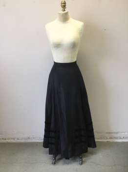 N/L, Black, Viscose, Solid, Black Faille Tafetta with Black Ribbon Horizontal Trim at Hemline with Plastic Jet Buttons and Tassle Trim at Front. Zipper at Center Back. Hem Tacked at Back Hem  Need to Be Stitched Invisibly. Hole at Center Back, See Photo Attached,