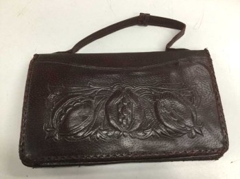N/L, Brown, Leather, Solid, Dark Burgundy Brown Leather Clutch, with Embossed Detail At Front, Short 1/2" Wide Strap, Metal Snap Clasp Closure, Brown Leather Lining, Inside Inscription Says "Miss Ruby Kirby, 56 Market Place, Malton."