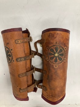 Unisex, Historical Fiction Greaves, MTO, Lt Brown, Faded Black, Leather, Metallic/Metal, Solid, Floral, Textured, Aged, 4 Brass Buckle Closures. 16" Wide At Top Of Calf. 2 Embossed Medallions, Dark Red Leather Trim At Top And Bottom. PAIR. MULTIPLE