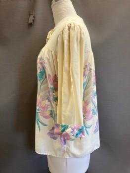 APPLE CORPS, Butter Yellow with Lav/pink/green Large Faded Floral, Pull On, Key Hole Front with Tie At Neck, L/S with Turned Up Floral Cuffs, Front And Back Yoke
