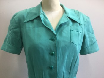 N/L MTO, Jade Green, Silk, Solid, Broadcloth, Short Sleeves, Shirtwaist, Pointy Collar Attached, Folded Sleeve Cuffs, Tiny Patch Pocket at Bust, Padded Shoulders, Pleats at Center Front Waist/Bust, Flared/Full Skirt, Knee Length, 2 Pockets at Hips, Made To Order, Bodice Flatlined in Muslin. Has Stress Marks at Front of Sleeve, See Detail Photo, Multiples,
