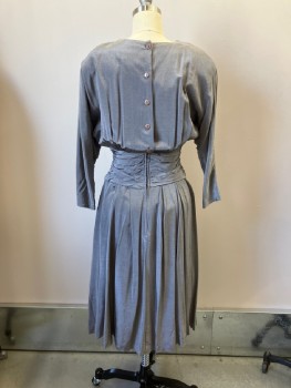DAWN JOY, Pewter Gray, Rayon, Solid, 2 Color Weave, Sharkskin, Jewel Neck, Shoulder Pads, Decorative Button Detail At Left Shoulder And 3 Pleats At Right Shoulder,  Dolman L/S, Self Waist Sash Insert with Triangular Button Tab Detail CF, Button And Zip Back Closure, Pleated Flared Skirt To Below Knee