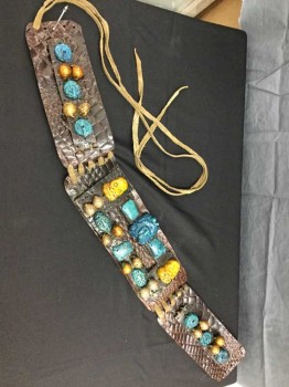 Unisex, Sci-Fi/Fantasy Belt, M.T.O., Dk Brown, Turquoise Blue, Turmeric Yellow, Gold, Leather, Fiberglass, Mayan Influenced Belt. Reptile Textured Brown Leather with Turquoise & Turmeric Skulls & Mayan God Headpieces Sculpted In Fiberglass/resin with Gold Painted Beads, Leather Wang Lacing At Center Back, Waist