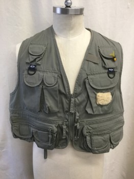 Mens, Wilderness Vest, COLUMBIA, Dk Olive Grn, Cotton, Polyester, Solid, 2XL, Zip Front, V-neck, Lots of Pockets, 1 Large Back Zip Pocket,  1 Yellow Lure Attached to Pocket, 1 Shearling Patch, Hunting and Fishing