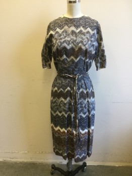 LUCINDA, Gray, White, Black, Brown, Viscose, Zig-Zag , Zig Zag Printed Fabric. Crew Neck, Short Sleeves, Fitted with Triple Belts of Self Tubing. Zipper Center Back,