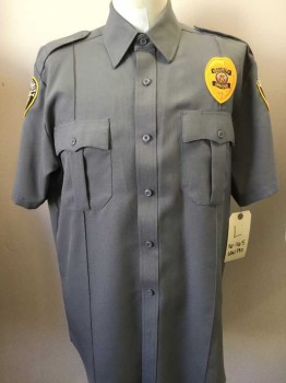 LAW PRO, Gray, Polyester, Solid, Button Front, Collar Attached, Short Sleeves, Epaulets, 2 Pleat Flap Pocket, Stitched Creases. 3 N.D. Security Guard Patches 2 on Sleeves, 1 on Front