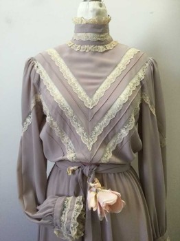 STRAUSS, Mauve Pink, Cream, Polyester, Solid, with Matching Self Belt. Mauve Crepe with Cream Lace Inlay at Chevron Pattern and Laced Trim Cuffs on Long Sleeves, High Collar Band with Lace Trim. Elasticated Waist. Self Crepe Belt with Hook & Eye Closure Center Back and Light Pink Flower at Front Belt with Faux Tie