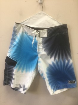 Mens, Swim Trunks, BILLABONG, Blue, White, Navy Blue, Polyester, Abstract , W:33, Large Starburst/Circles Pattern, White Shoelace Style Lacing/Ties at Center Front, Velcro Closure at Fly, 1 Cargo Pocket at Hip, 10.5" Inseam