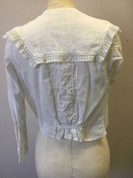 NL, White, Cotton, Solid, Floral, Button Front, Long Sleeves, Sailor Collar. Lace Trim on Collar Cuffs and inlayed on Sleeves and Front Panels. Tuck Pleats at Back. Tape at Center Back Cut Off. Hole on Left Collar at Shoulder. Holes at Right Elbow,