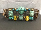 M.T.O., Dk Brown, Turquoise Blue, Turmeric Yellow, Gold, Leather, Fiberglass, Mayan Influenced Belt. Reptile Textured Brown Leather with Turquoise & Turmeric Skulls & Mayan God Headpieces Sculpted In Fiberglass/resin with Gold Painted Beads, Leather Wang Lacing At Center Back, Waist