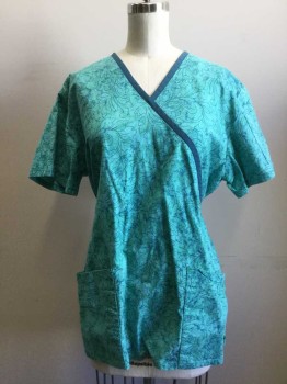 NL, Green, Navy Blue, Cotton, Floral, Foliage Print on Mottled Minty Background. Teal Trim at V. Neck with Diagonal Cross Strap Short Sleeves, Adjustable Waist with Back Waist Tie