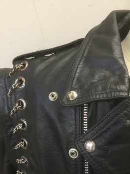 Mens, Leather Jacket, JAMIN LEATHER, Black, Leather, Solid, L, Motorcycle Jacket, Zip Front, Silver Metal Chain Woven Through Large Silver Grommets at Armscyes, Epaulettes at Shoulders, 3 Zip Pockets + 1 Flap Pocket with Silver Studs/Snap, **Separate Self Belt with Silver Buckle, Lining is Burgundy Quilted and Detaches