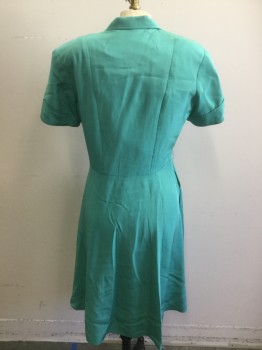 N/L MTO, Jade Green, Silk, Solid, Broadcloth, Short Sleeves, Shirtwaist, Pointy Collar Attached, Folded Sleeve Cuffs, Tiny Patch Pocket at Bust, Padded Shoulders, Pleats at Center Front Waist/Bust, Flared/Full Skirt, Knee Length, 2 Pockets at Hips, Made To Order, Bodice Flatlined in Muslin. Has Stress Marks at Front of Sleeve, See Detail Photo, Multiples,