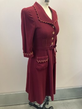 MTO, Red Burgundy, Wool, Solid, 3/4 Slv, 4 White & Brown Snowflake Btn Frt Placket, Attached Self Belt, Wide Scallopped Collar Pkt Detail with Orange & Beige Embroiderred Trim, 6 Panelled Skirt, Snaps At Side