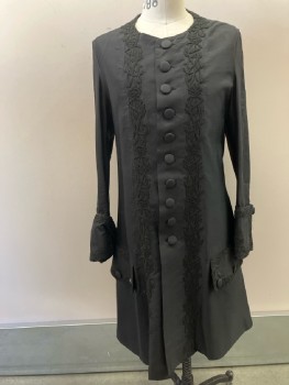 MTO, Black, Silk, Solid, 18th Century Frock Coat, Round Neck,  No Collar, Black Embroiderred Trim, 10+ Btns Front, 2 Big Flap Pckt Below Waist with 3 Button Detail, L/S, Wide Turned Up Cuffs with Single Button, Side Slits And Vent CB