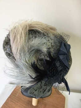 MTO, Lt Blue, Navy Blue, Gray, Straw, Feathers, Paisley/Swirls, Lt Blue Straw Flat Hat (pulling Apart), Grayish Blue Rope Trim, Gray/Lt Blue/Navy Feathers, Navy Cotton Bow with Mesh Underlay, Navy Straw Bow, Lt Blue/gray Paisley Cotton Bow, Brim Wider In Front,