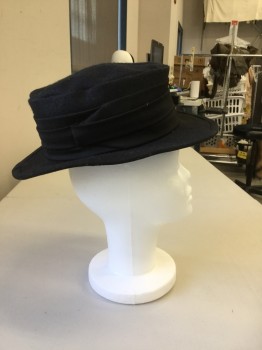 NL, Black, Wool, Solid, Felt Hat. Soft Flat Top with  Wide Flat Brim, Pleated Gabardine Band Around Hat Some Pile on Back Left Side of Hat,