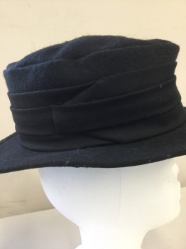 NL, Black, Wool, Solid, Felt Hat. Soft Flat Top with  Wide Flat Brim, Pleated Gabardine Band Around Hat Some Pile on Back Left Side of Hat,