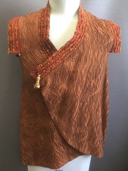 N/L MTO, Orange, Rust Orange, Ochre Brown-Yellow, Polyester, Cotton, Abstract , Crinkled Texture Material, Rust Trim at Armholes and Neck with Eyelash Fuzzy Stripes, Wrapped Closure with Wooden Hanging Bead Accent Over Hidden Snap Closure, Lining is Ikat Patterned Cotton