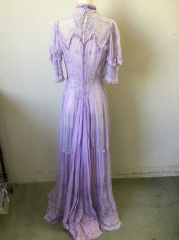 MTO, Lavender Purple, Cotton, Solid, Floral, Sheer Batiste, Pin Tucks in Net Yoke, Lace Ruffles, Heavy Cotton Lace Short Sleeves and High Neck, Insertion Lace in  Skirt with Pin Tucks, Lavender Floral Embroidery at Skirt Hem with Pin Tucks,  Crochet Covered Buttons Down Center Back,