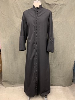 Unisex, Cassock, CHURCH STORES, Black, Wool, Solid, 38, Fabric Covered Button Front, Stand Collar, Long Sleeves, Oversized Folded Back Cuff, Floor Length Hem, Pleated Center Back, Side Seam Pleats with Pocket Slits