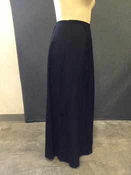 MTO, Black, Wool, Solid, Gaberdine Wool, Tuck Pleat Panel Detail at Front and Back of Skirt. Hidden Hook & Eye Closure Under Left Back Panel. Triple Inverted Pleat Detail at Side Seam Hemline with 2 Covered Button Detail on Left & Right Side. Hole Repair at Right Side Hemline,