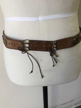 Unisex, Historical Fiction Belt, N/L, Dk Brown, Brass Metallic, Blue, Amber Yellow, Red, Leather, Metallic/Metal, Dots, Novelty Pattern, (double) Dark Brown Reptile  Belt W/brass Inlay Work Detail W/blue  Round Stones and Amber & Red Stone in the Middle, 2 Needle Pins and Brown Cord String Closure, See Photo Attached,